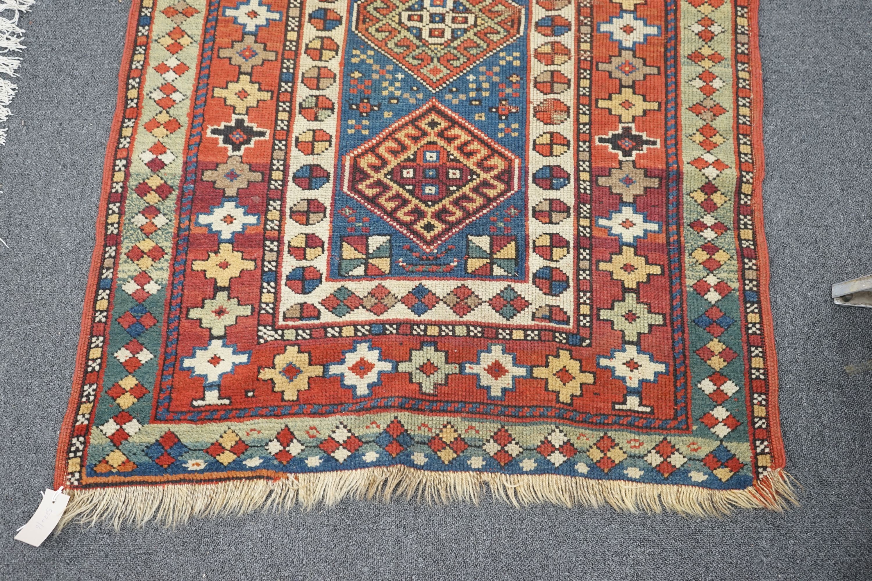 A Kazak blue ground rug, 152 x 95cm
